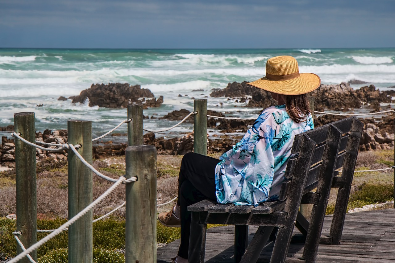 woman sitting, seaside, rocks